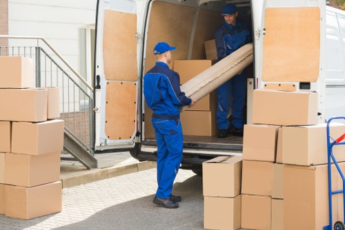 House removal team planning a move in Bow with boxes and furniture