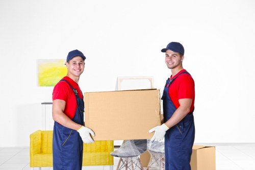 Office removals team preparing desks and equipment in Bow