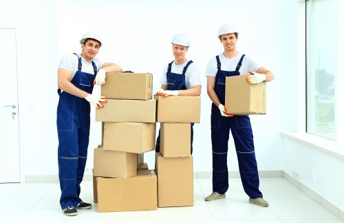 Packed furniture and boxes loaded into a van for a Bow relocation