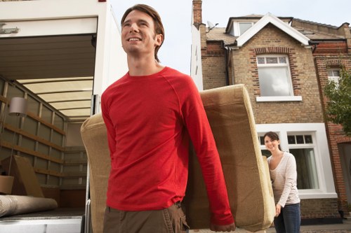 House move preparation inside a Bow apartment with stairs and hallway access