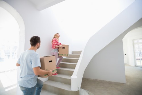 Removal van and packed boxes in an East London street