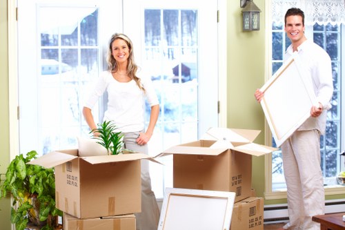 Moving van and packed boxes ready for a local removals job in Bow